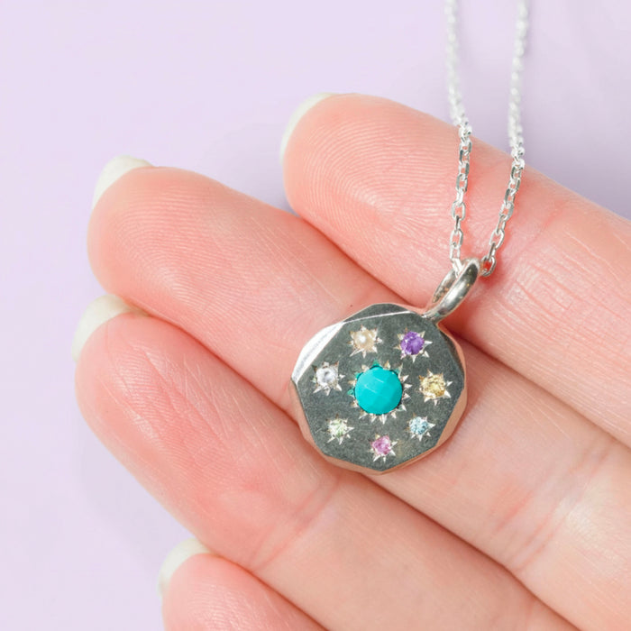 Sterling silver Stargazer round pendant set with 8 stones