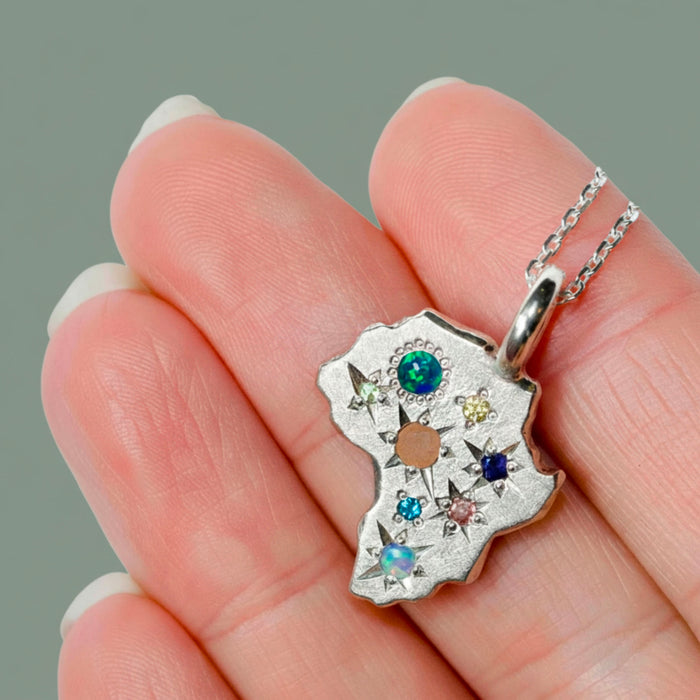 Sterling silver Stargazer Africa pendant set with multiple stones